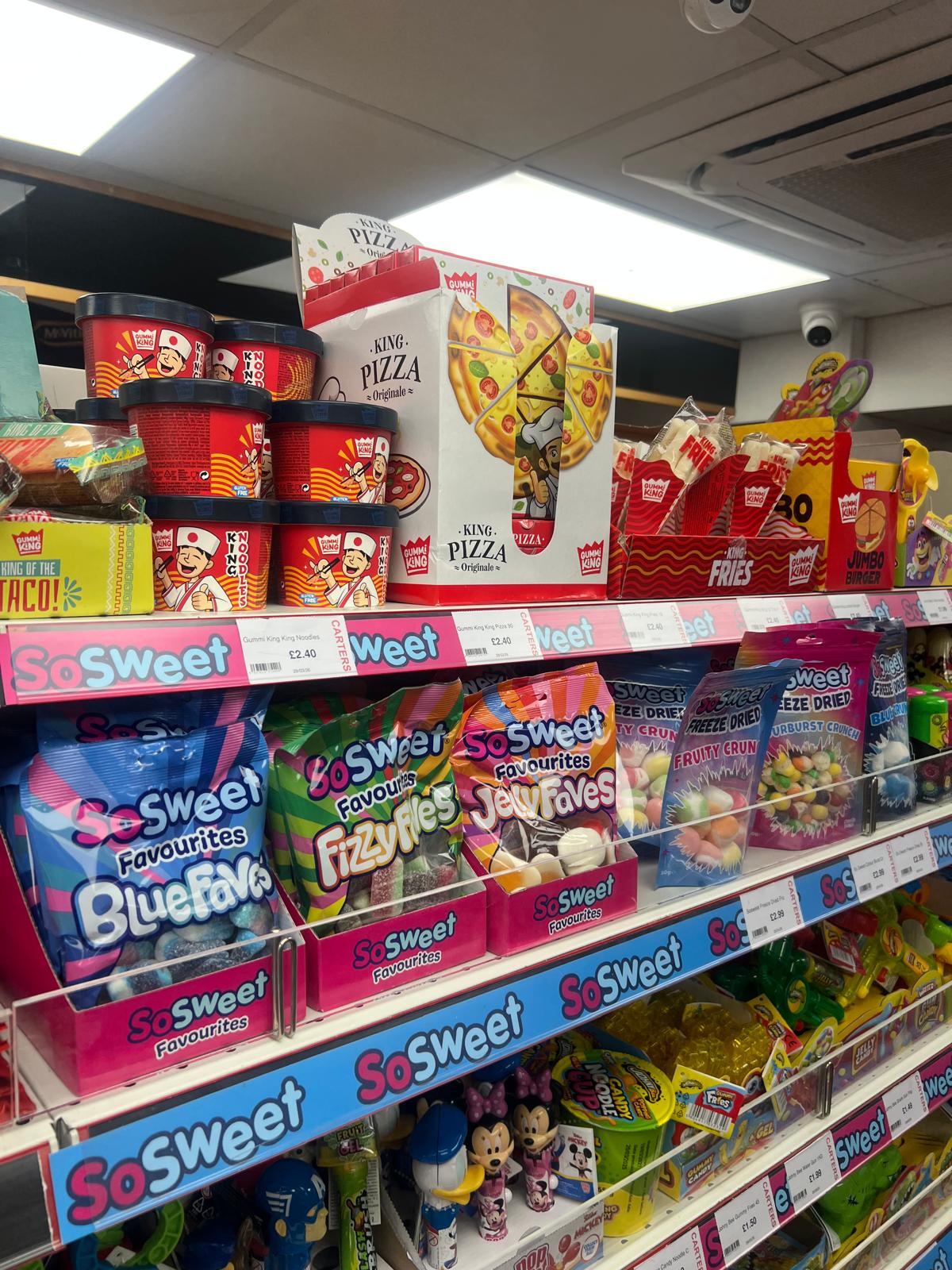 SoSweet products displayed on a retail shelf hook strip